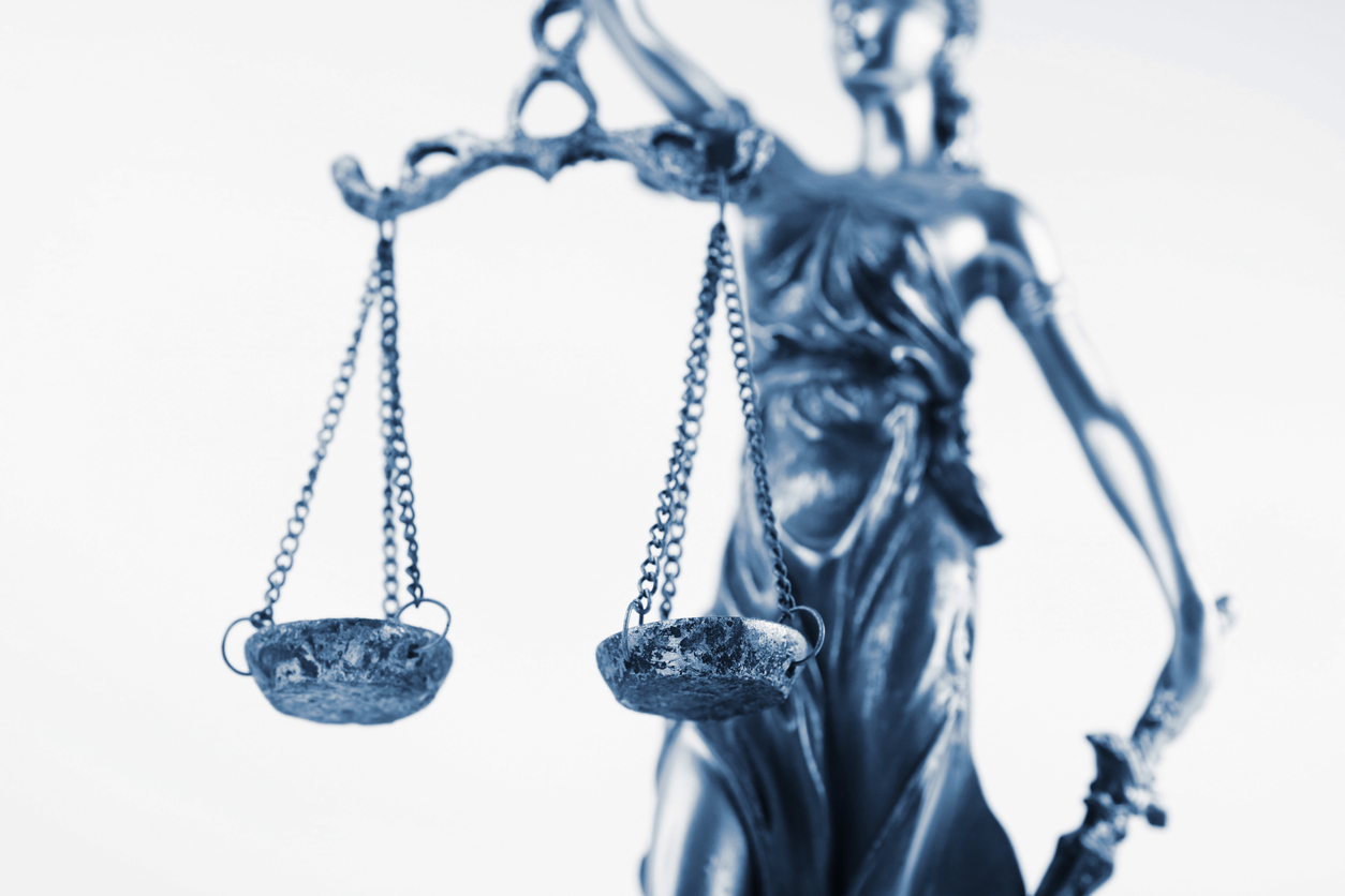 Status of justice with balancing scales.